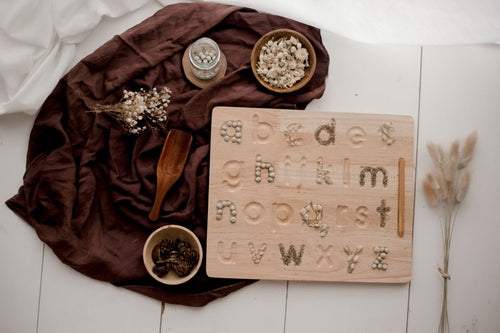 Lower case letter writing board